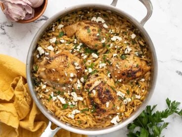 Overhead view of a pot full of lemon pepper chicken and orzo.