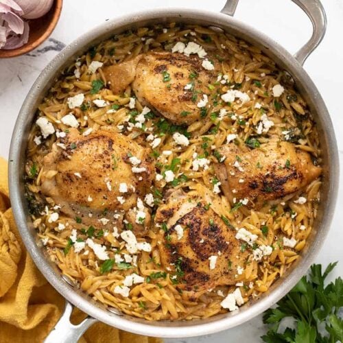 Overhead view of a pot full of lemon pepper chicken and orzo.