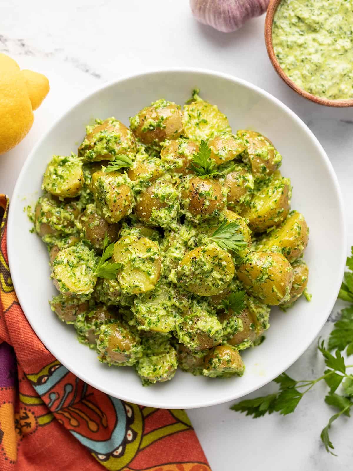 Overhead view of parsley pesto potato salad in a bowl.