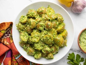 Overhead view of parsley potato salad in a bowl.