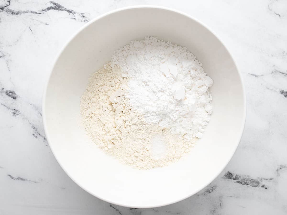 Dry ingredients for the shortbread crust in a bowl.