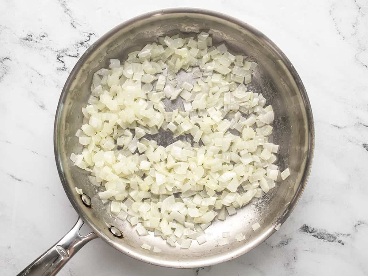 Sautéed onions in a skillet.