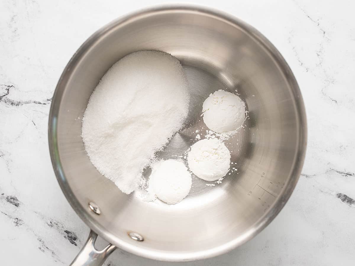 Overhead shot of sugar and cornstarch in a pot.