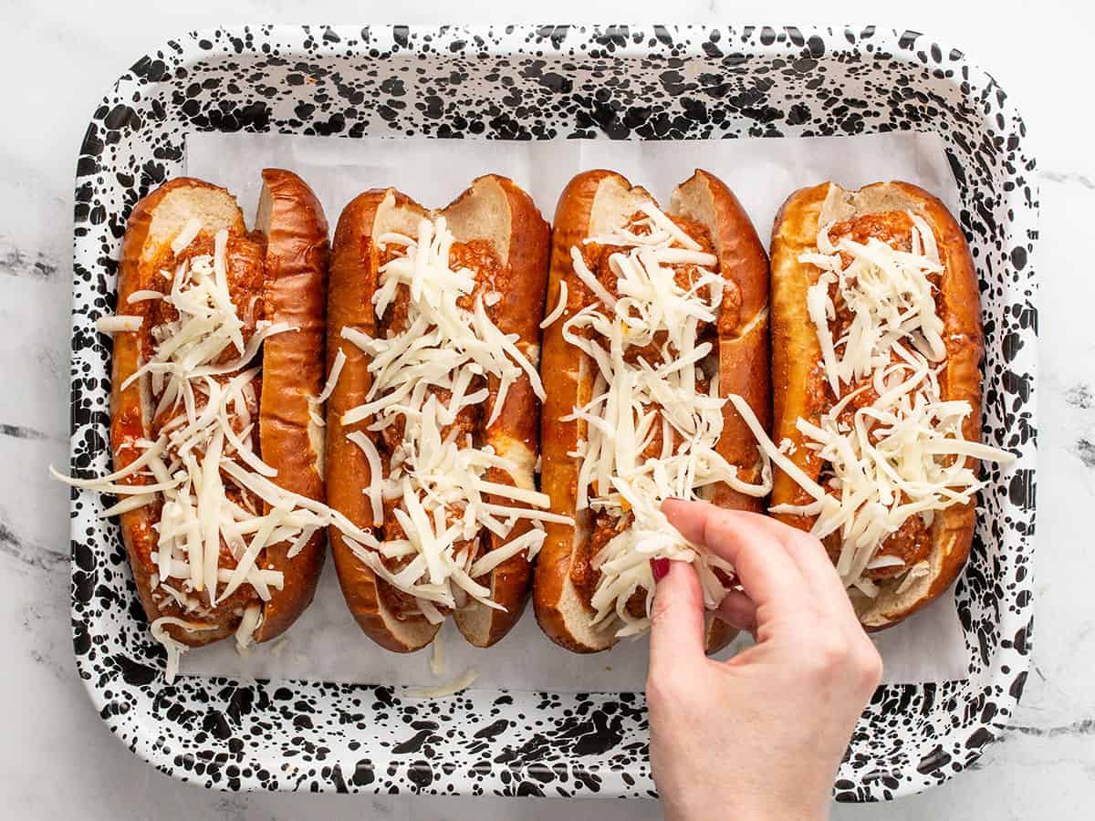 Shredded mozzarella on the meatball subs.