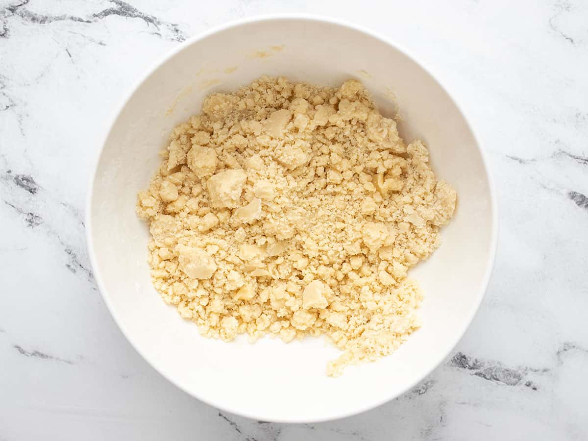 Shortbread crust mixture in a bowl.