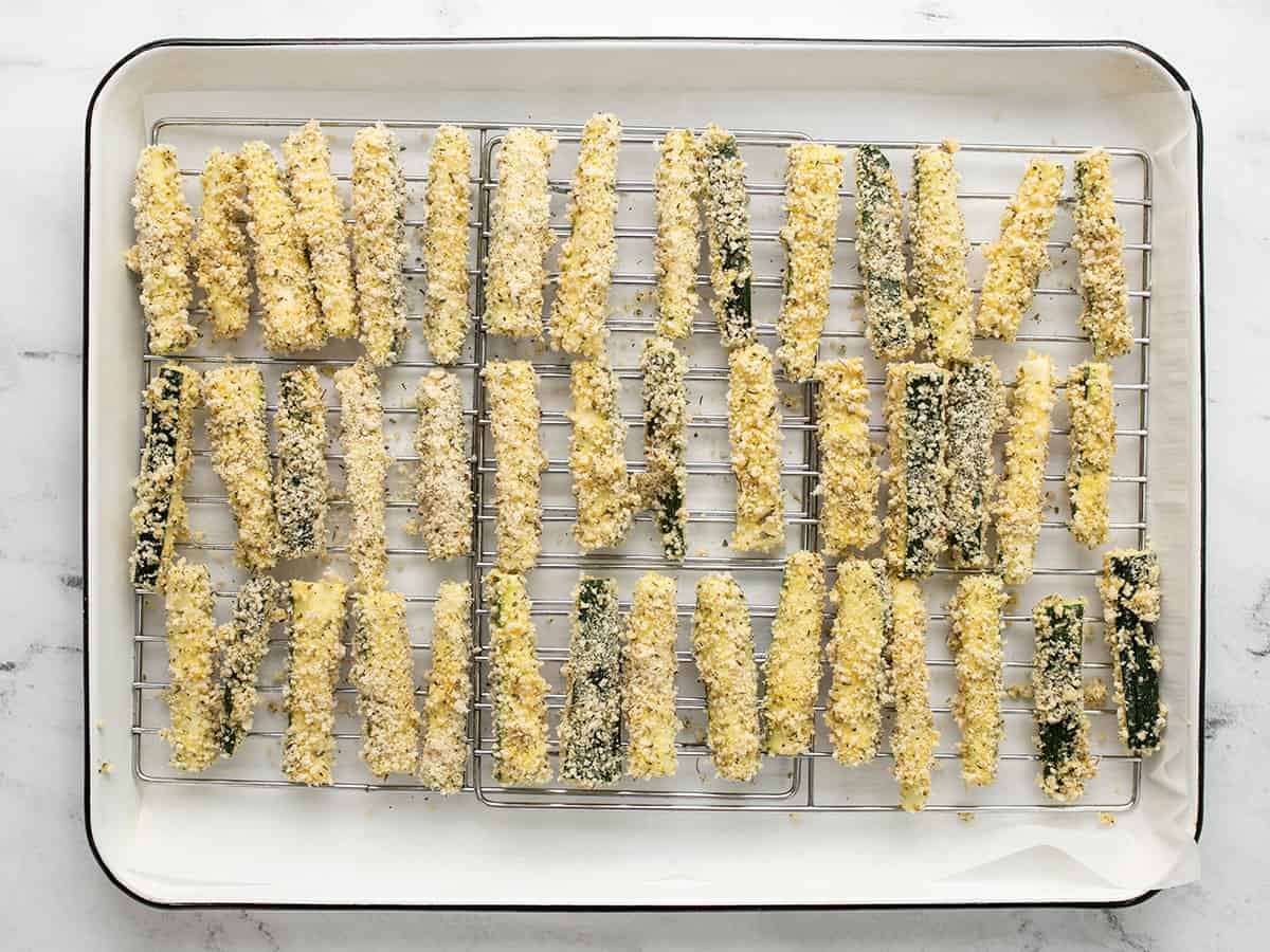 Zucchini fries on the baking sheet ready to bake.