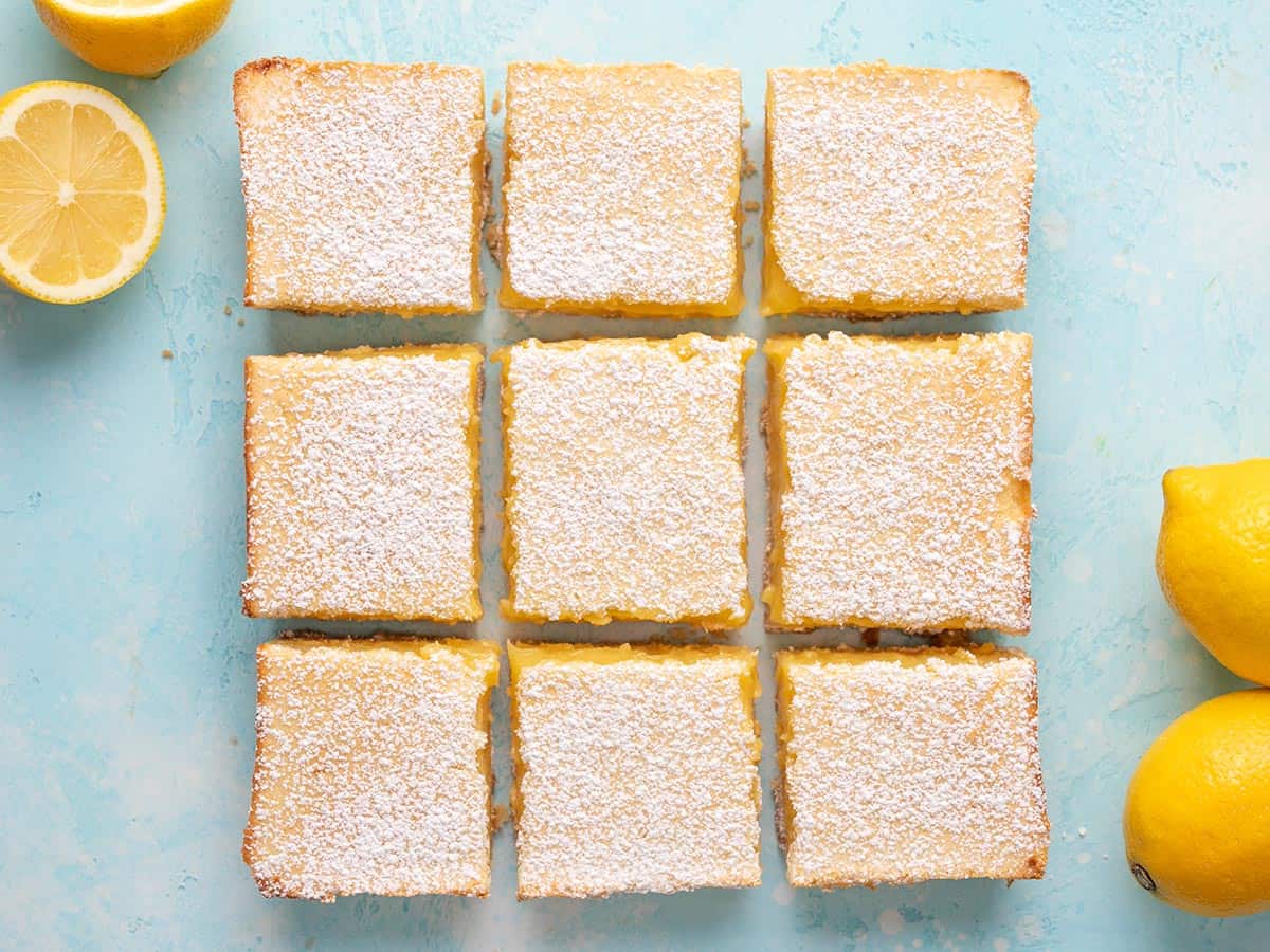 Overhead view of lemon bars sliced and placed in a grid.
