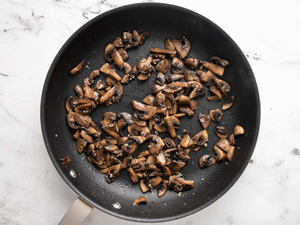 Sautéed mushrooms in the skillet.