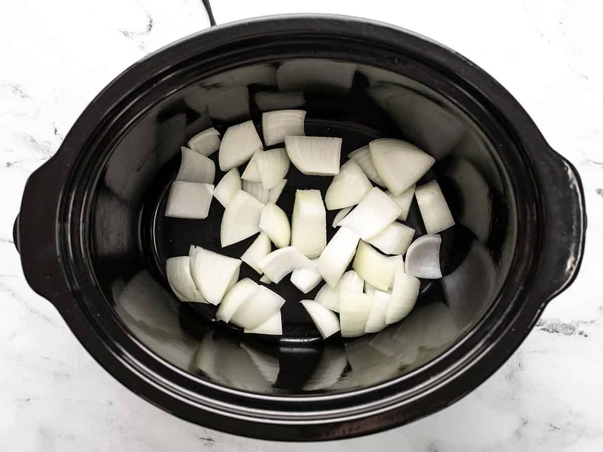 Diced onion in the slow cooker.