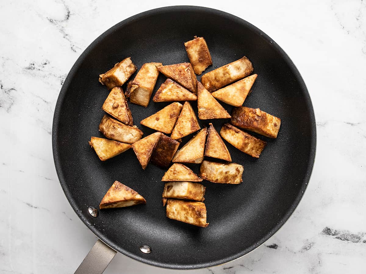 Cooked tofu in the skillet.