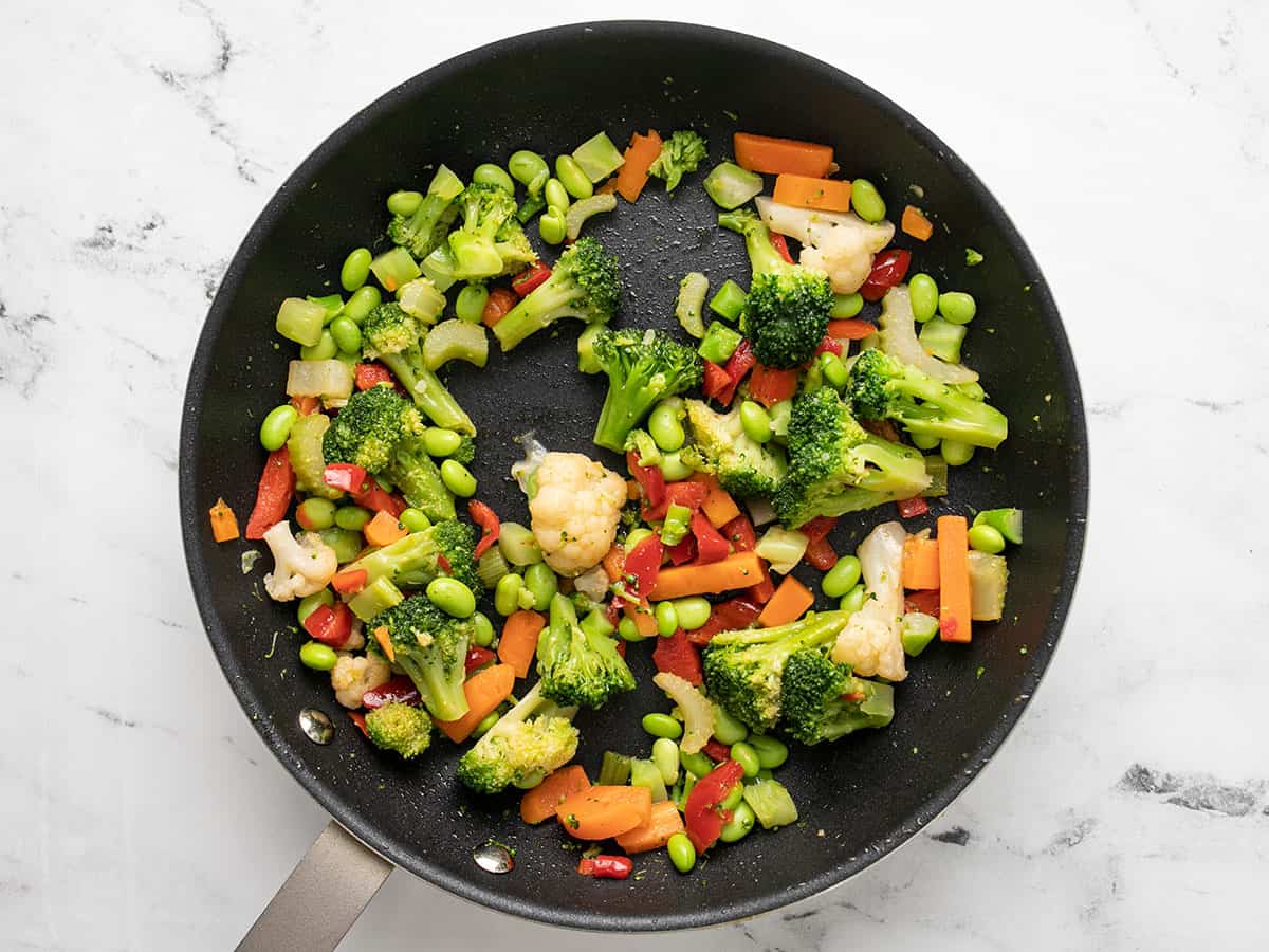 Stir fry vegetables in the skillet.