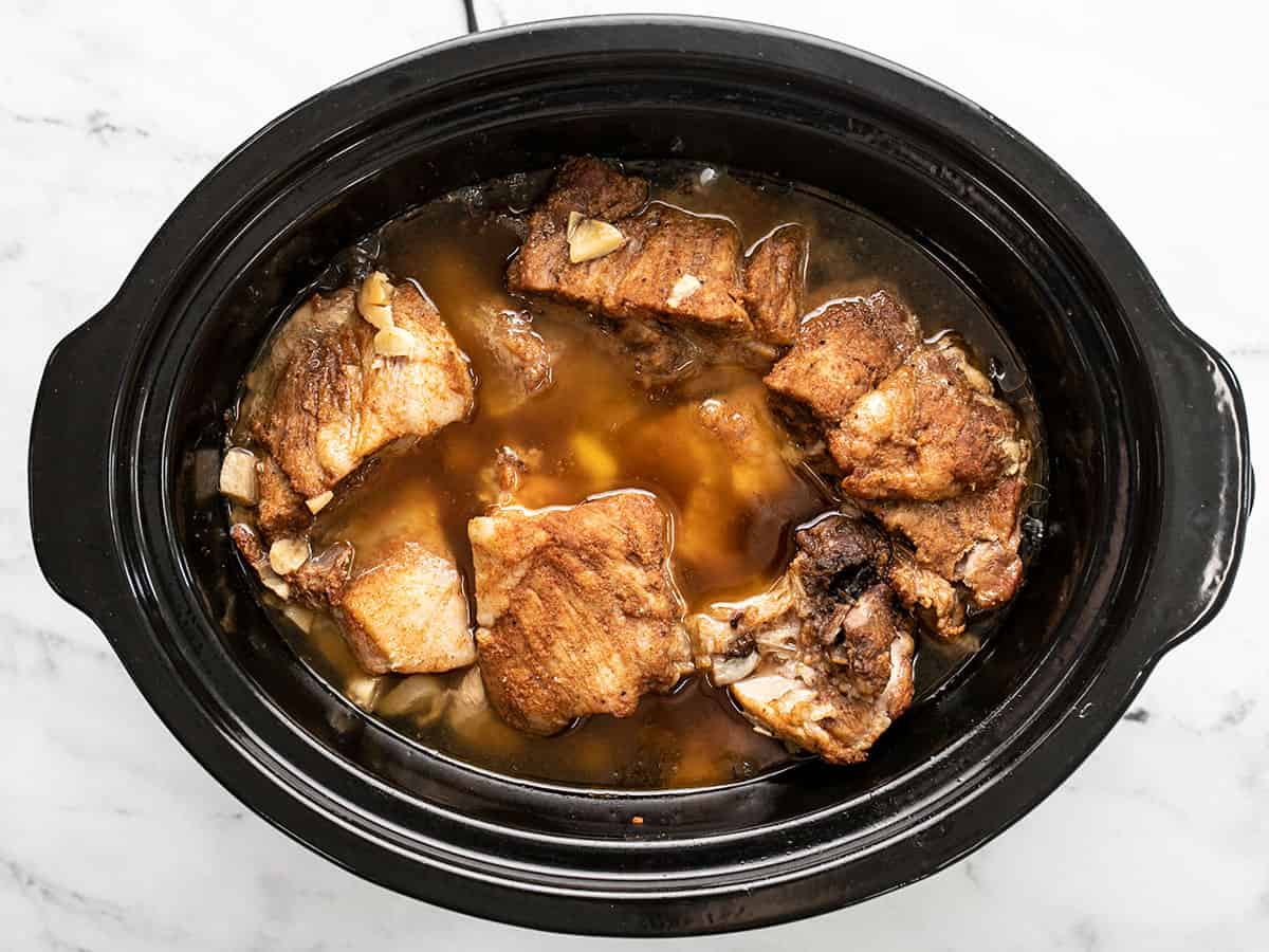 Cooked pork in the slow cooker.