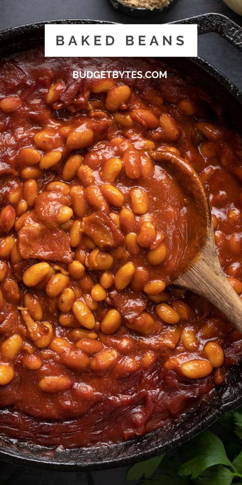 Close up overhead view of baked beans in a skillet.