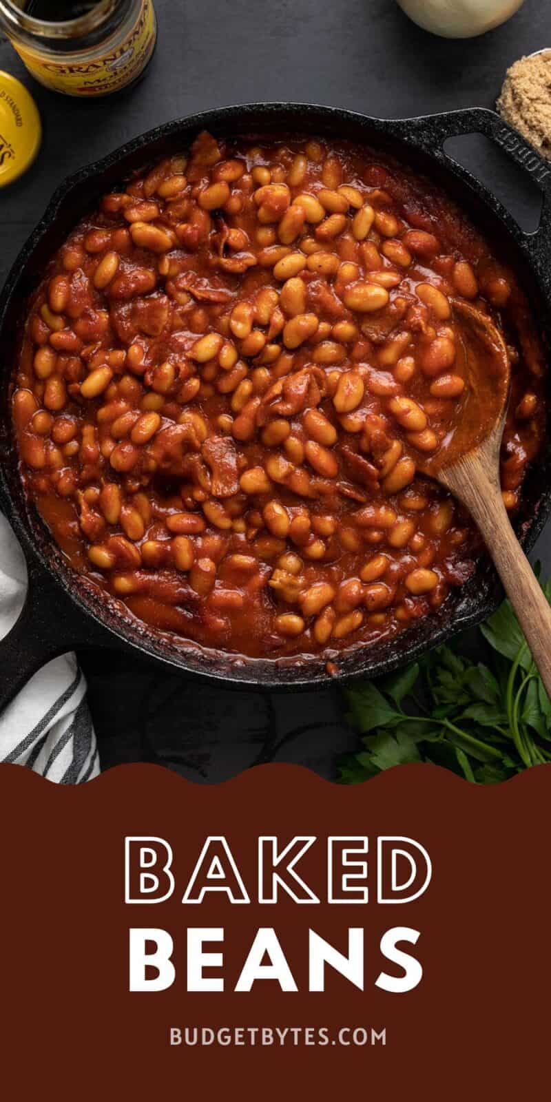 Overhead view of baked beans in a cast iron skillet.