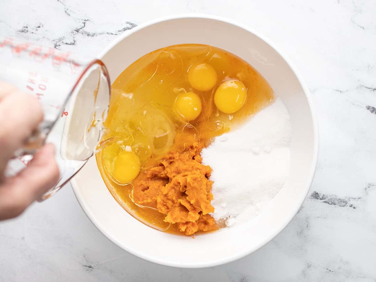 Overhead shot of wet ingredients in a white bowl.