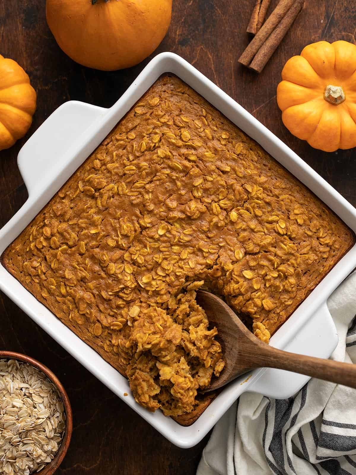 It tastes like dessert, but is healthy enough for breakfast! Baked Pumpkin Pie Oatmeal is a great "fix ahead" breakfast option. Budgetbytes.com Overhead view of baked pumpkin pie oatmeal in the baking dish being scooped with a wooden spoon.