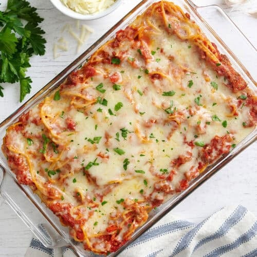 Overhead view of baked spaghetti in a baking dish.