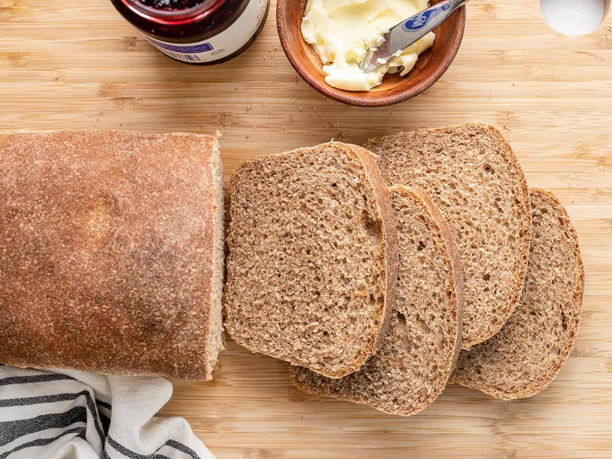 Overhead view of sliced honey wheat bread.