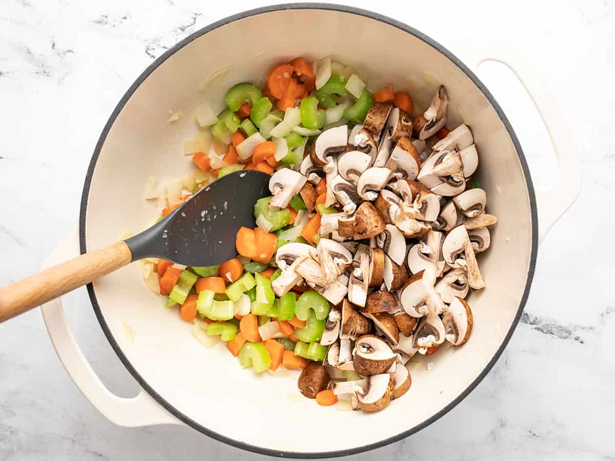 Sliced mushrooms added to the pot.