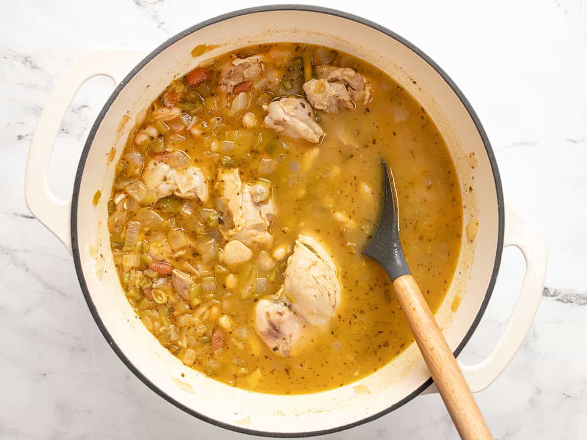 Simmered chili in the pot with a spoon.