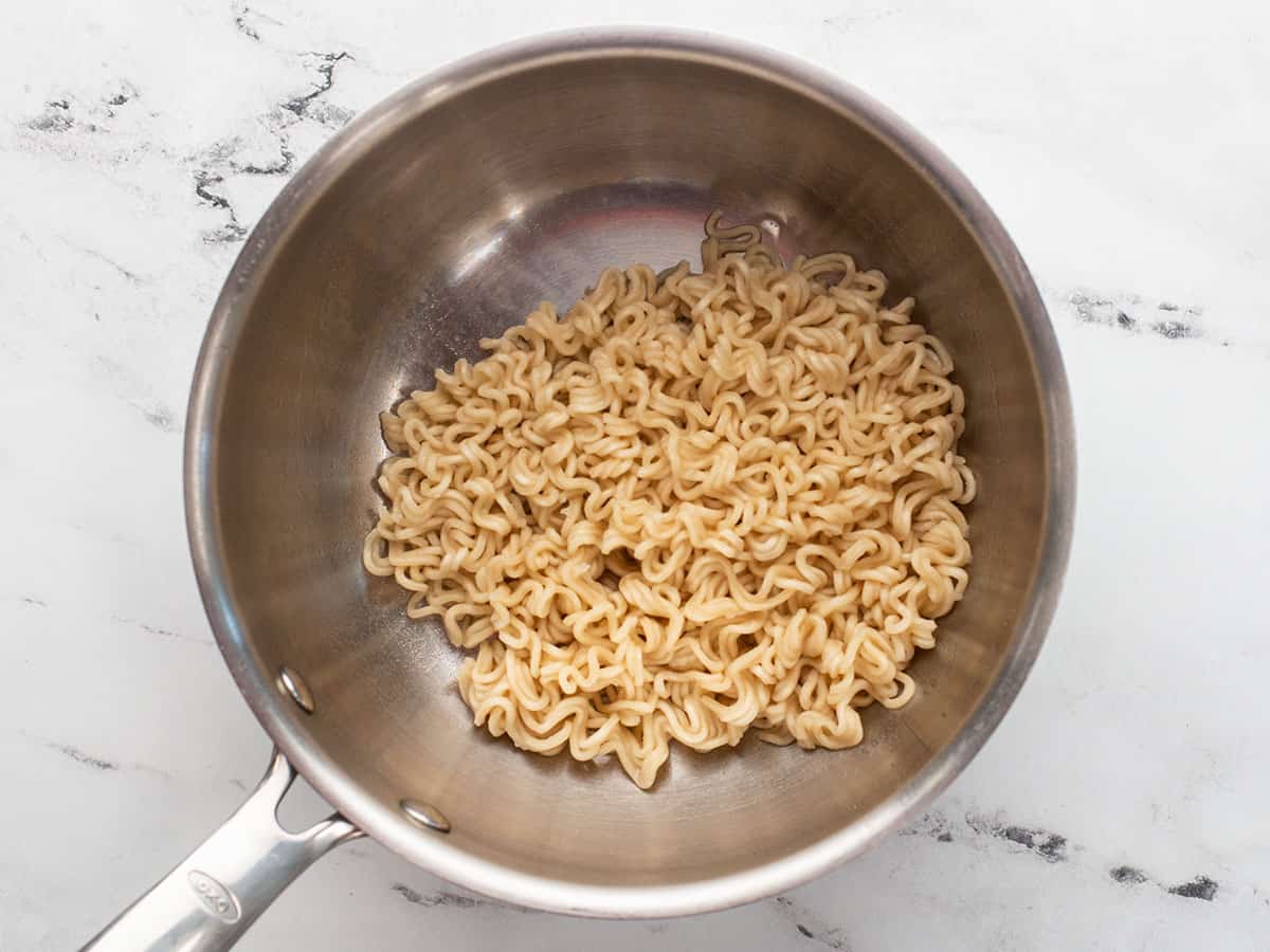 Boiled ramen noodles in a pot, drained.