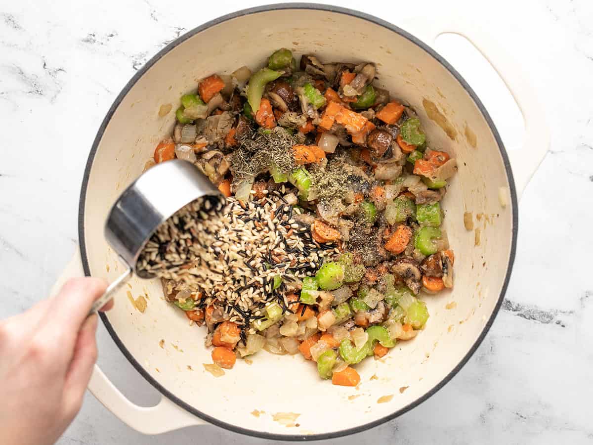 Wild rice blend and herbs added to the pot. 