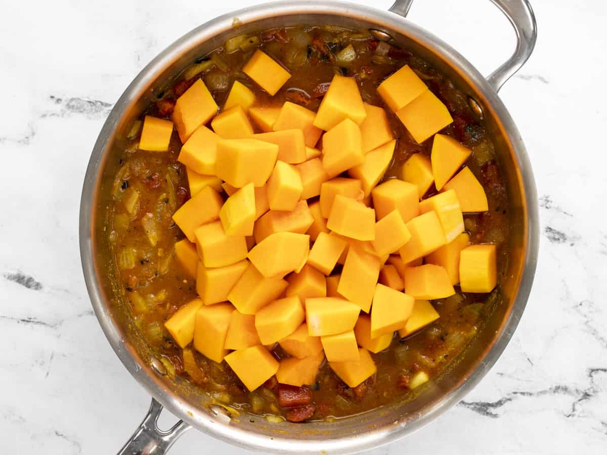 Butternut squash added to the skillet.