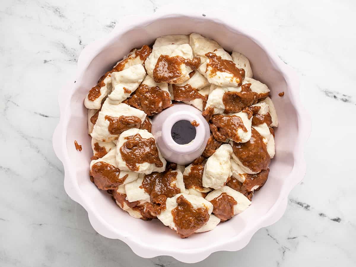 Overhead shot of raw Monkey Bread in a Bundt pan.