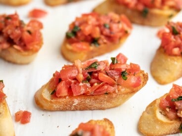 Side shot of bruschetta on a sheet pan.