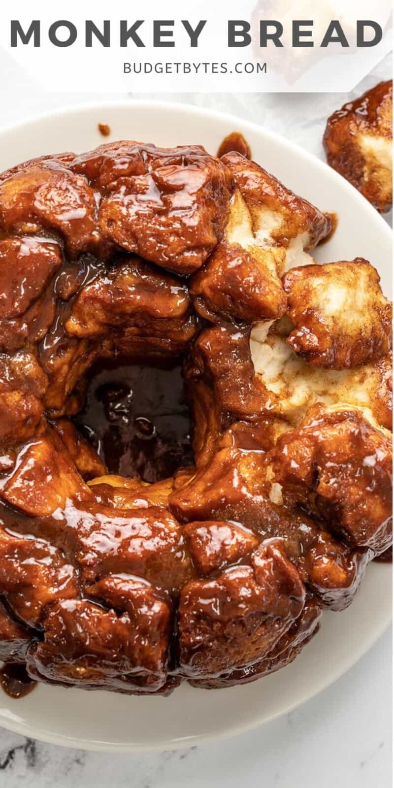 Overhead shot of monkey bread on white plate.