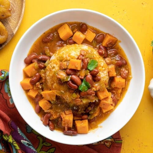 Overhead shot of a white bowl of red beans and rice.