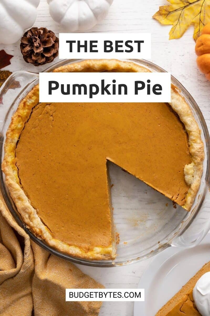 Overhead shot of a pumpkin pie with a slice taken out of it.