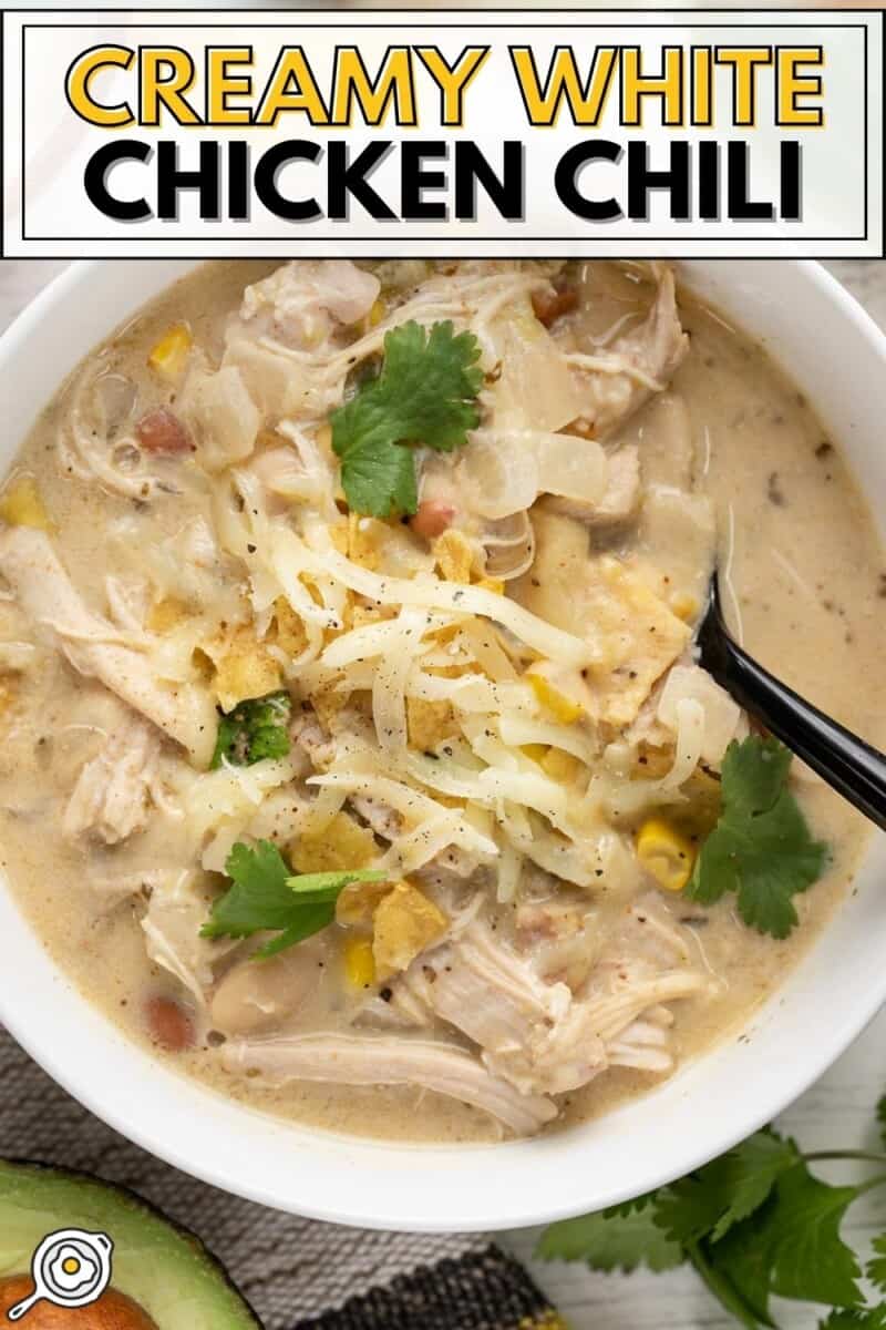 Close up overhead view of a bowl full of creamy white chicken chili.