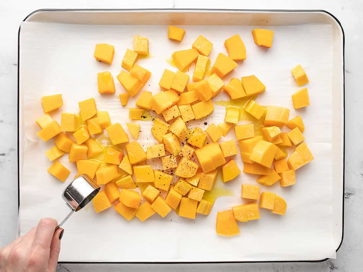 Butternut squash being prepped for roasting. 