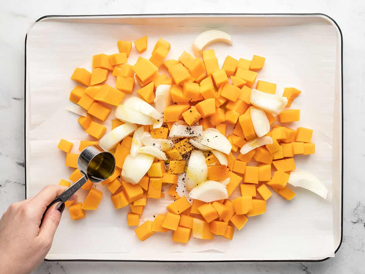 Butternut squash and onions being prepped for roasting. 