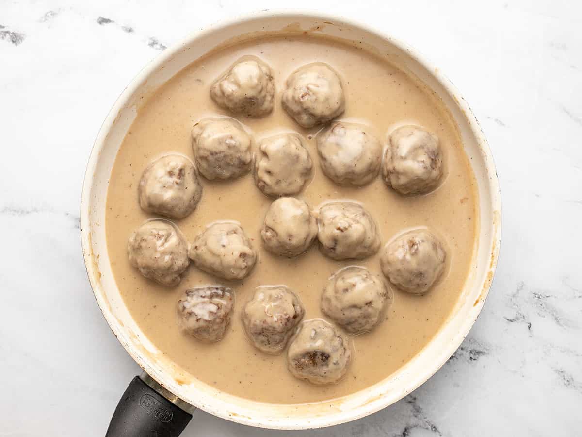 Finished Swedish meatballs in the skillet with gravy. 