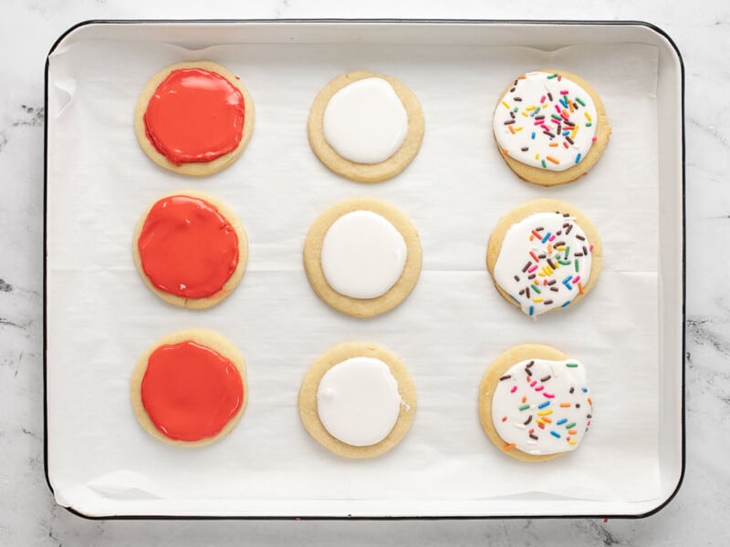 Overhead shot of decorated red and white sugar cookies.