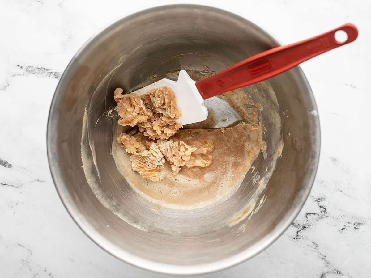 Overhead shot of chilled brown butter in a silver bowl.