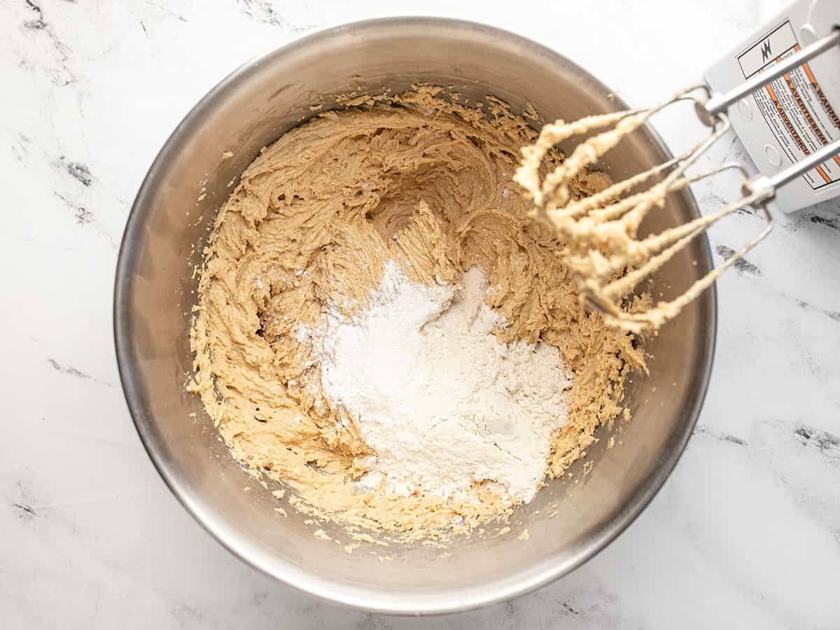 Flour added to the batter in the bowl. 