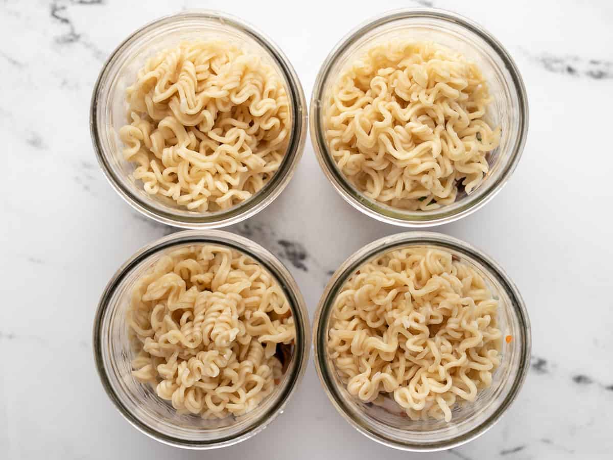 Noodles added to the jars. 