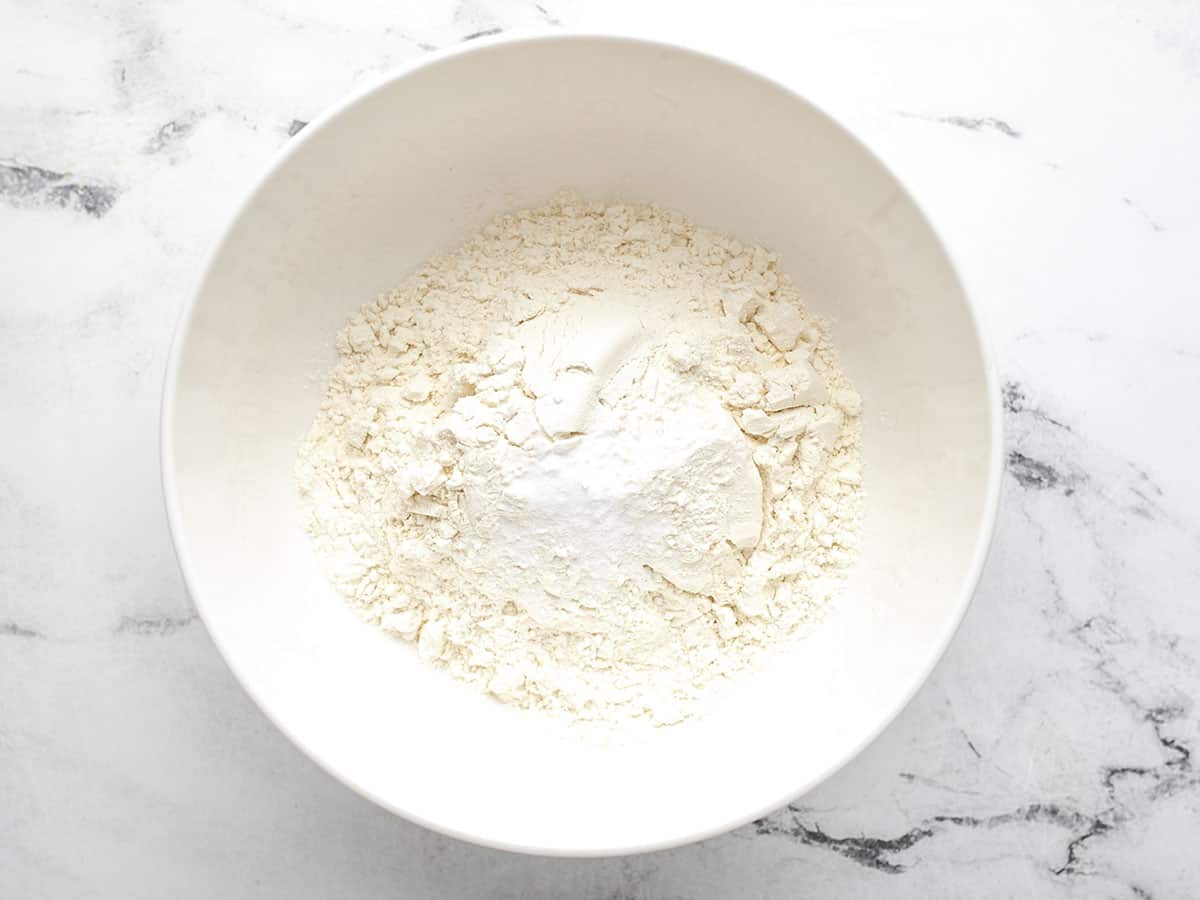 Overhead shot of dry ingredients in a white bowl.
