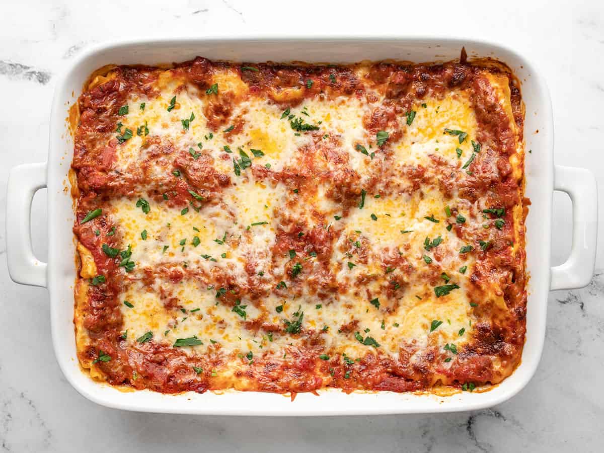 broiled lasagna topped with parsley. 