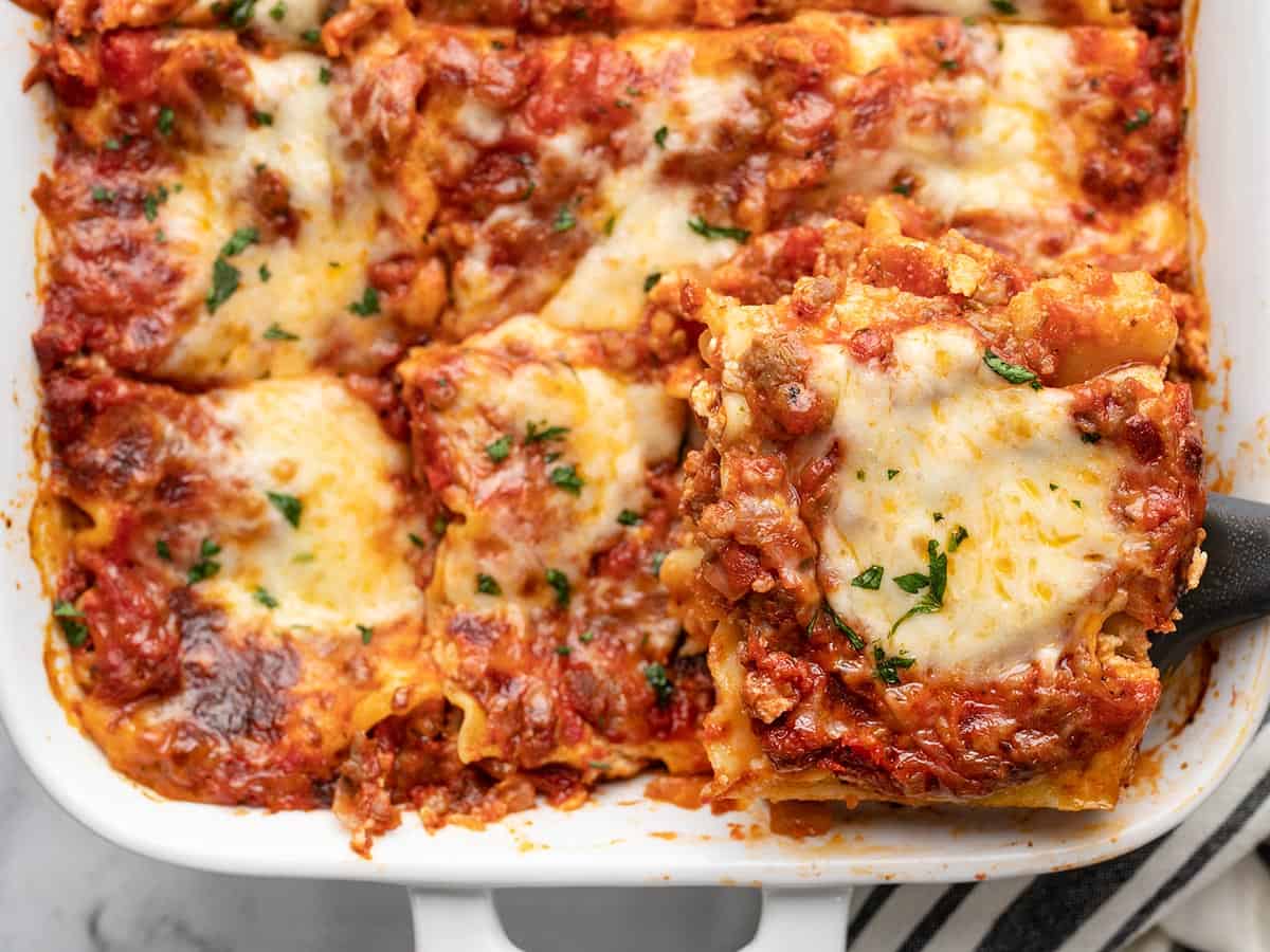 close up overhead view of sliced lasagna in the pan. 