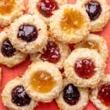 Overhead view of a pile of jam thumbprint cookies.