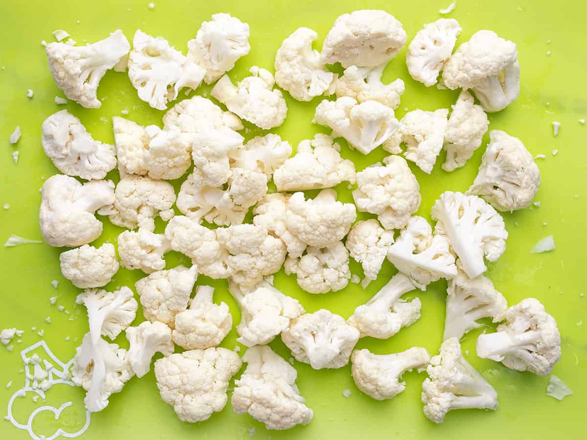 Cauliflower florets on a cutting board. 