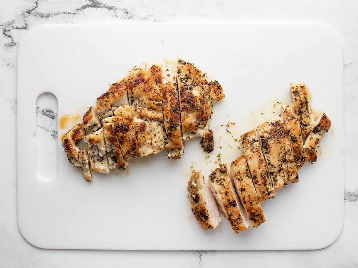 Sliced chicken breast on a cutting board.