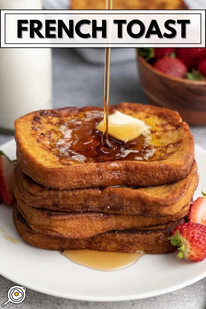 Syrup being poured over a stack of french toast with melted butter on top.