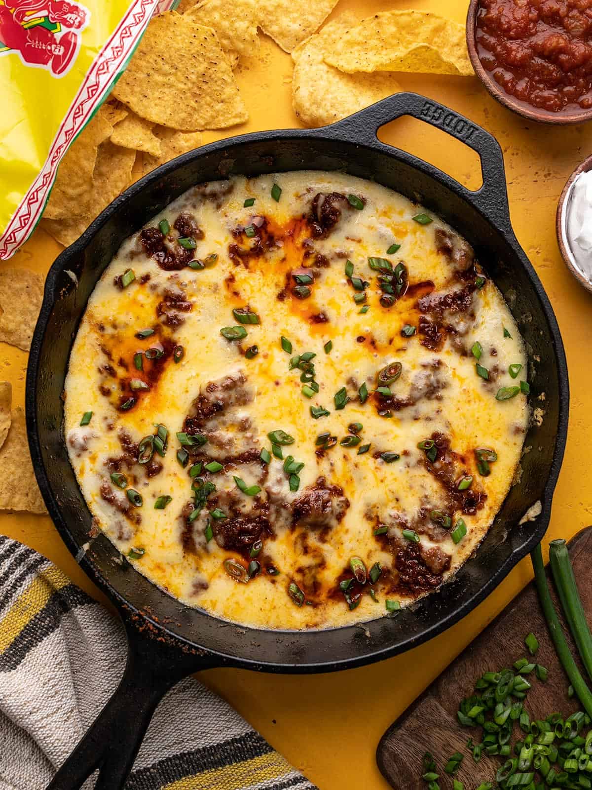 Overhead shot of Queso Fundido in a cast iron pan .
