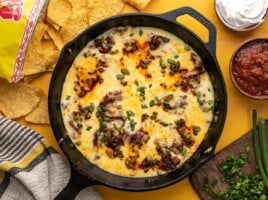 Overhead shot of Queso Fundido in a cast iron pan.