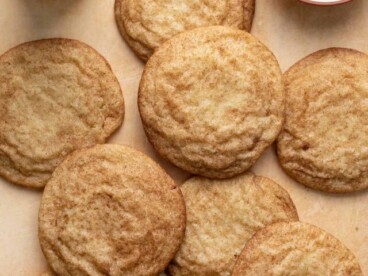 Overhead shot of snickerdoodles next to a glass of milk.